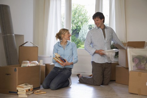 Professional moving team handling furniture during a Thamesmead house removal